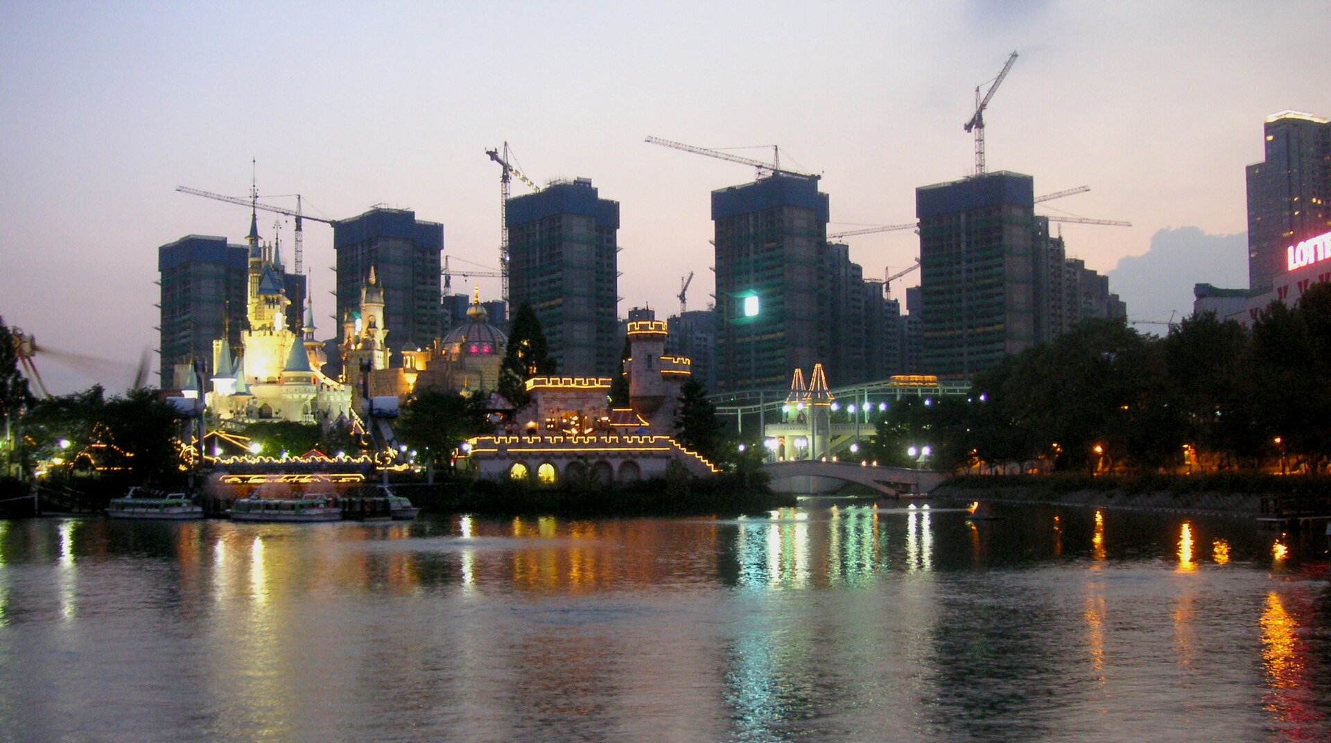 An evening view toward Magic Island and surrounding buildings.