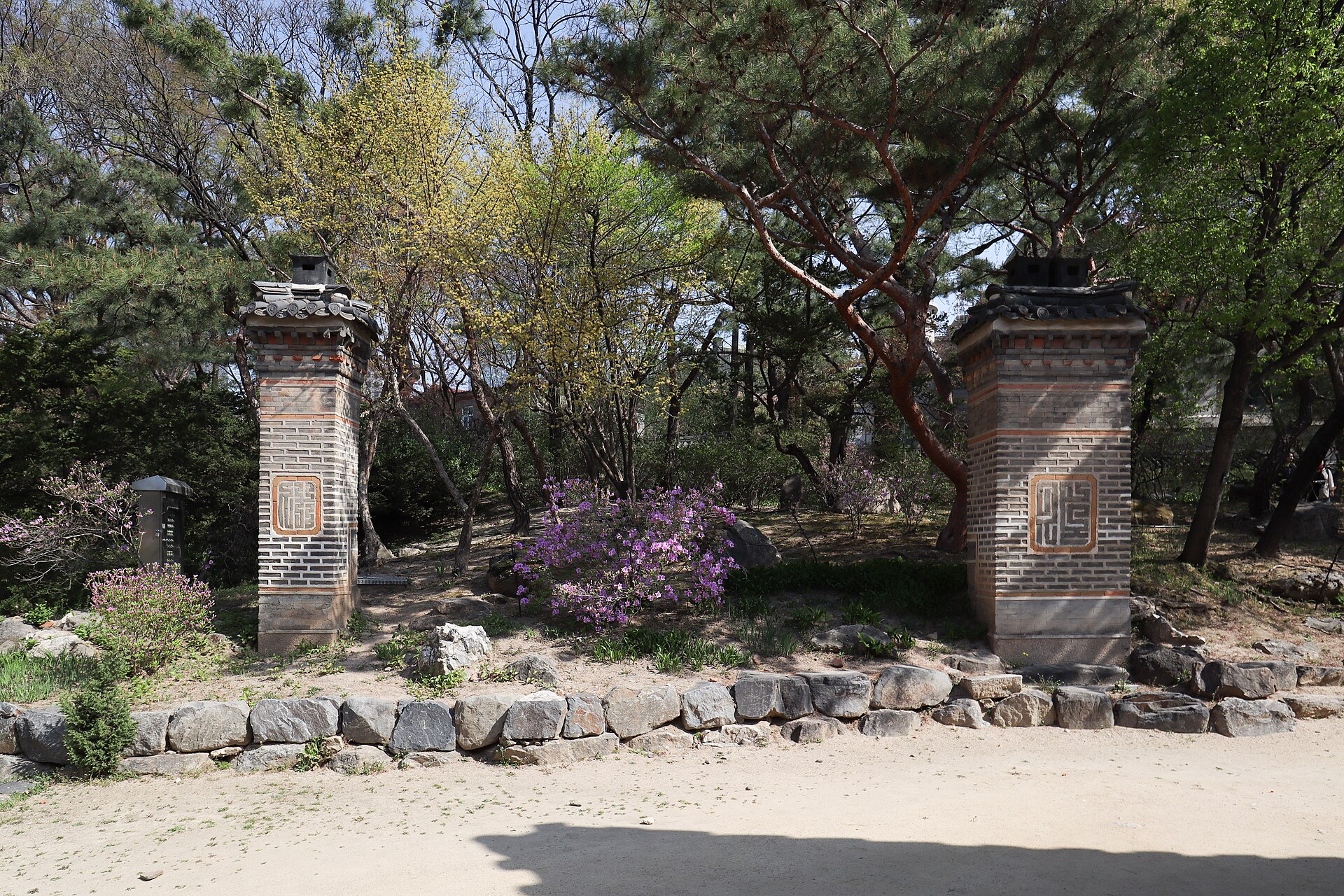 A quieter view between the palace buildings and trees.