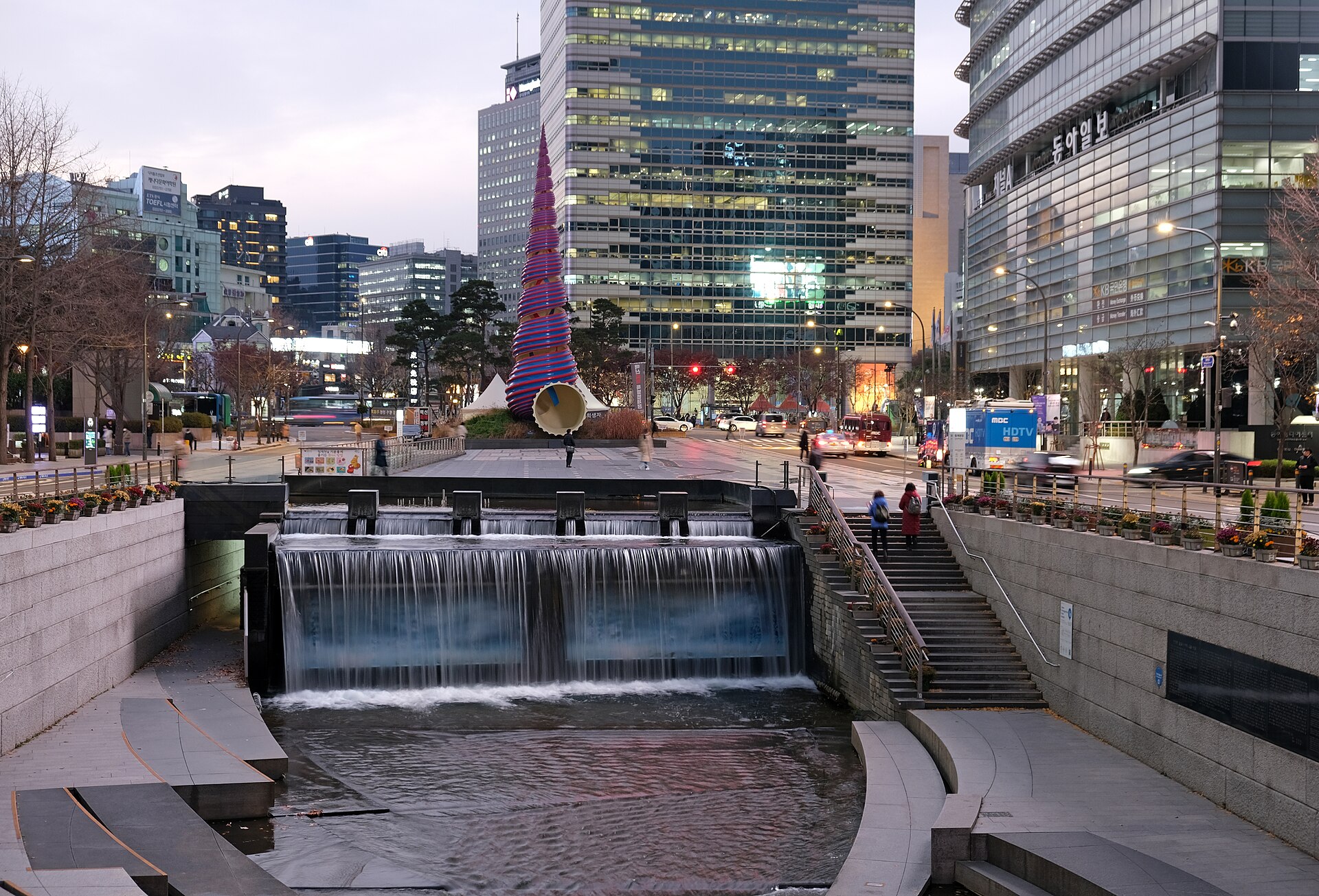 The stream and pedestrian space near its western beginning.