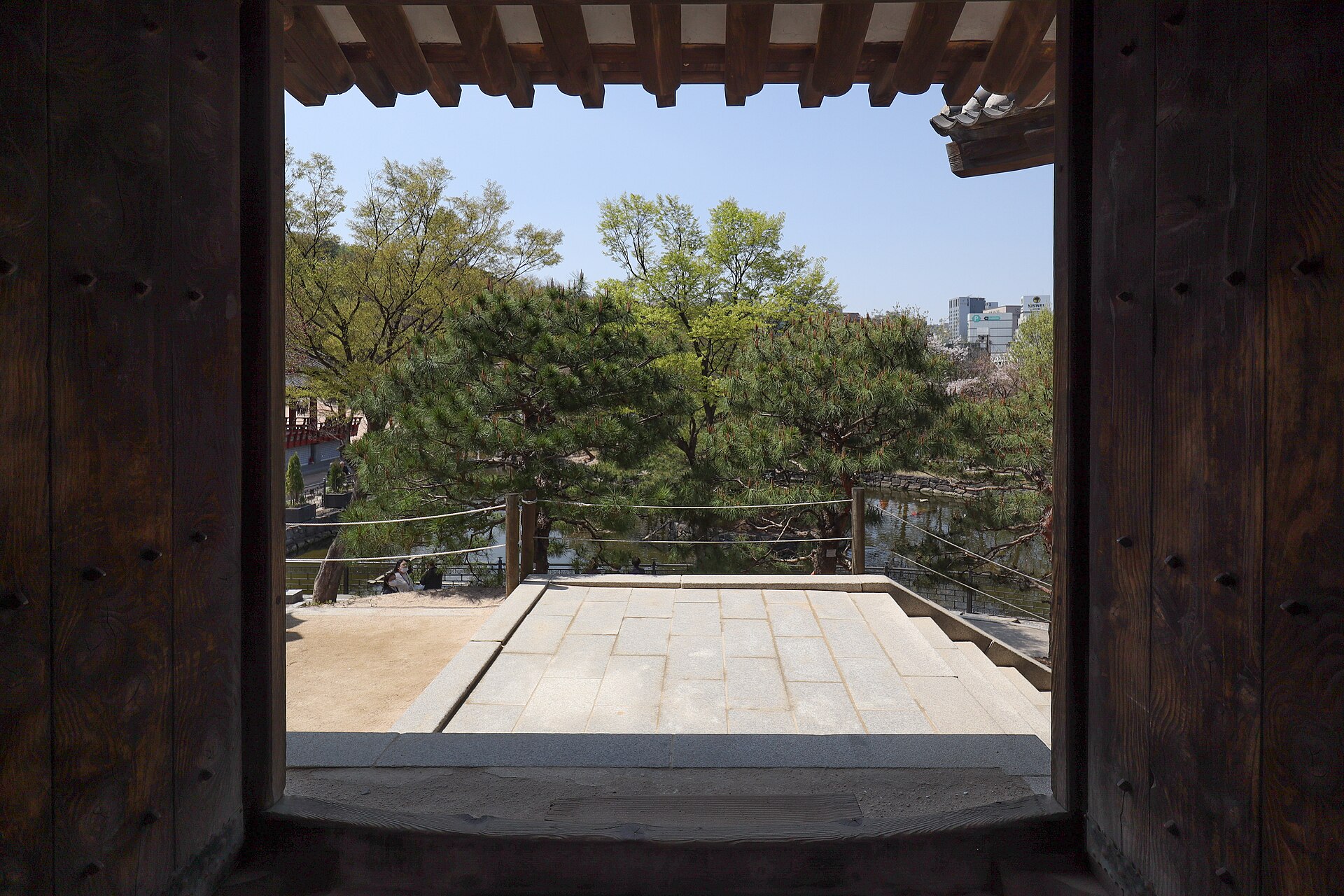 A framed view toward the courtyard and trees.