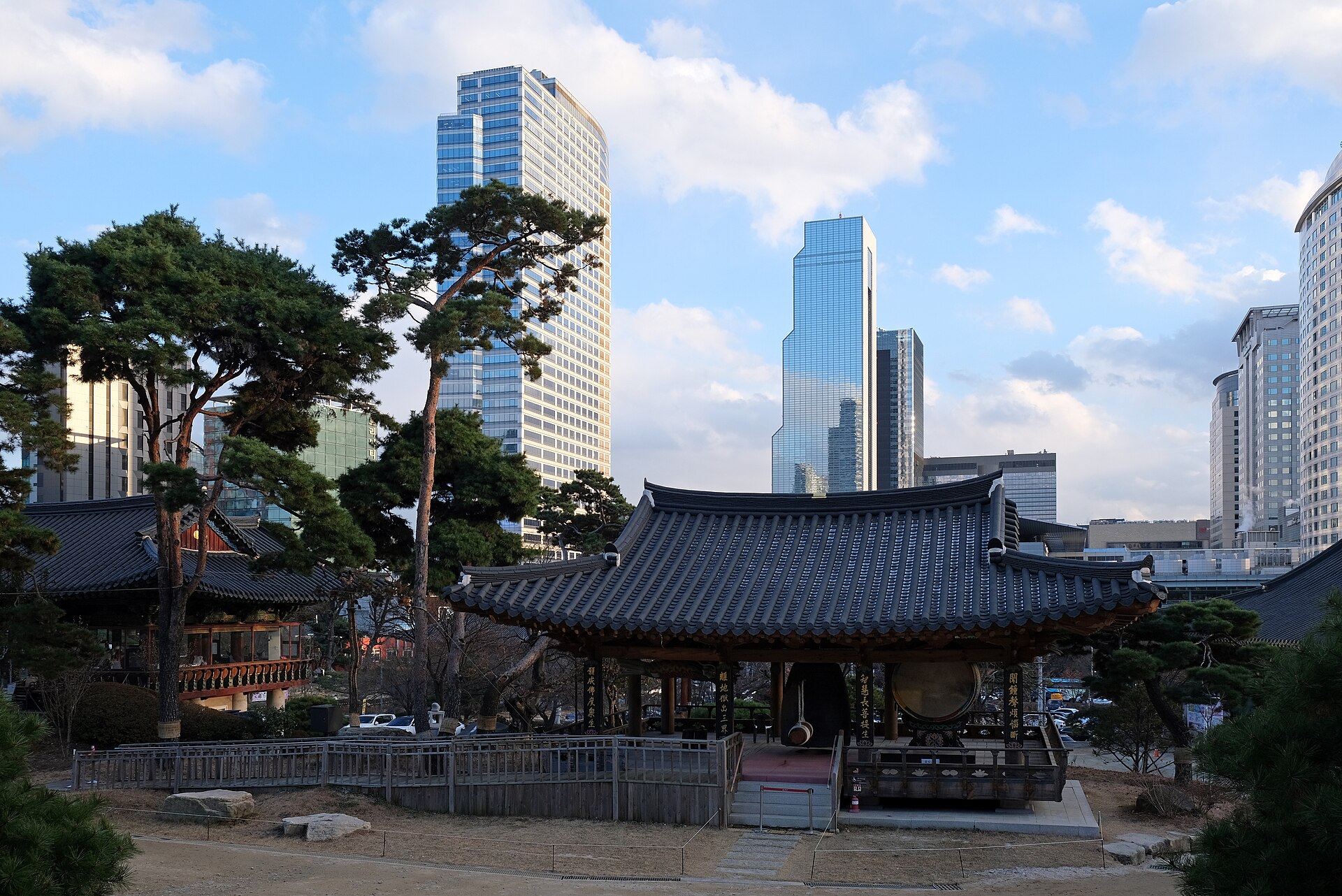 Temple roofs within the modern city.