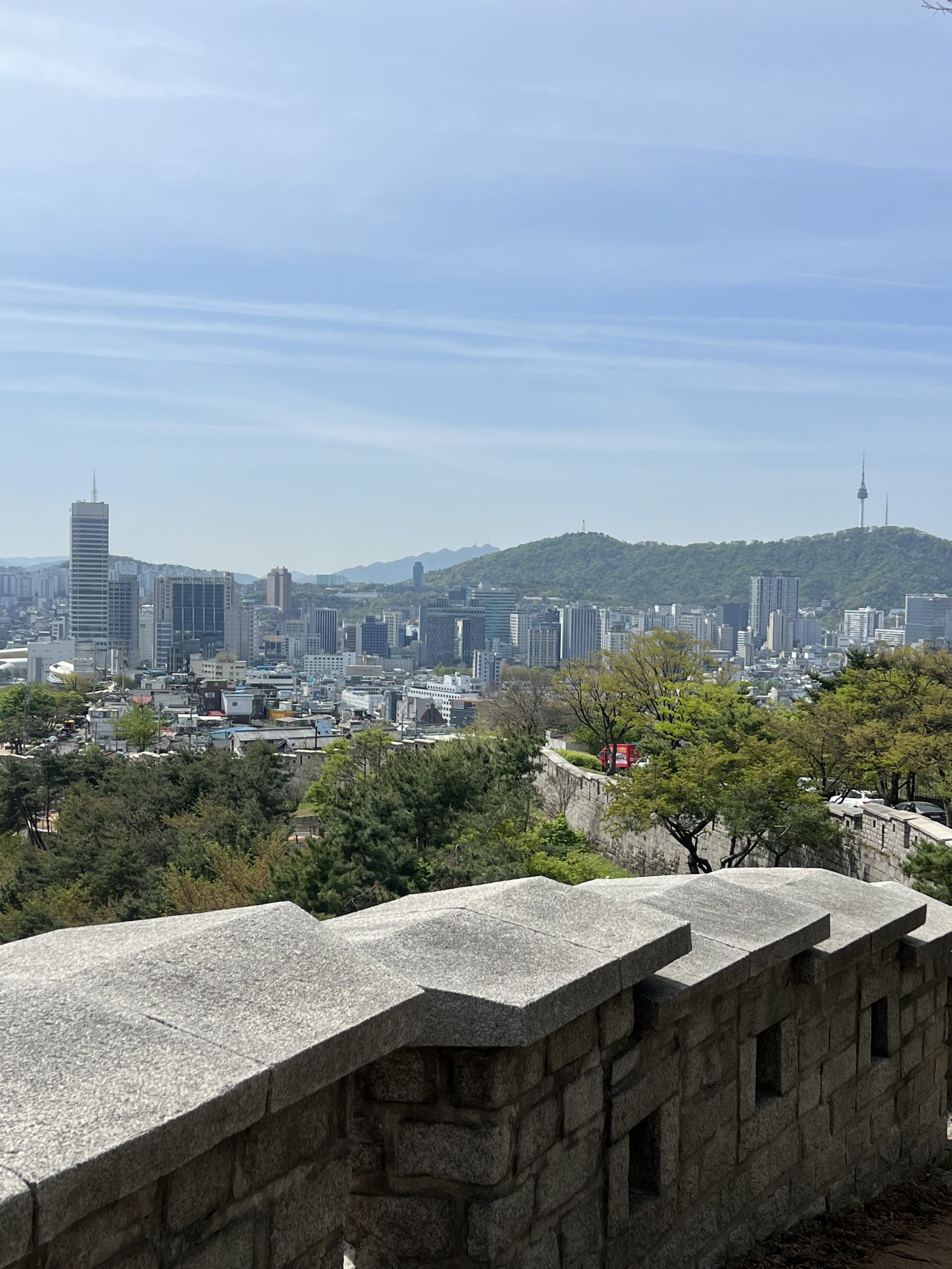 View over Seoul from the city wall at Naksan Park in April 2026