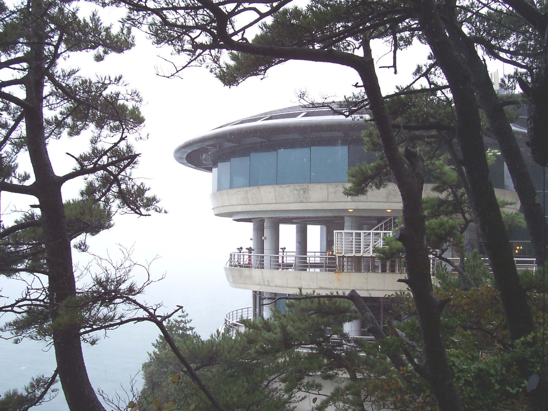 The rounded Taejongdae observatory building among trees