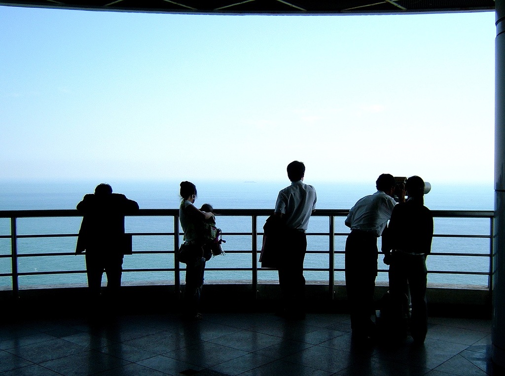 Visitors looking out to sea from the Taejongdae observatory