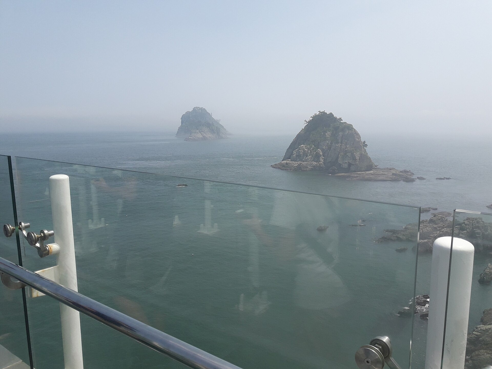 Rocky Oryukdo islands seen beyond the skywalk railing