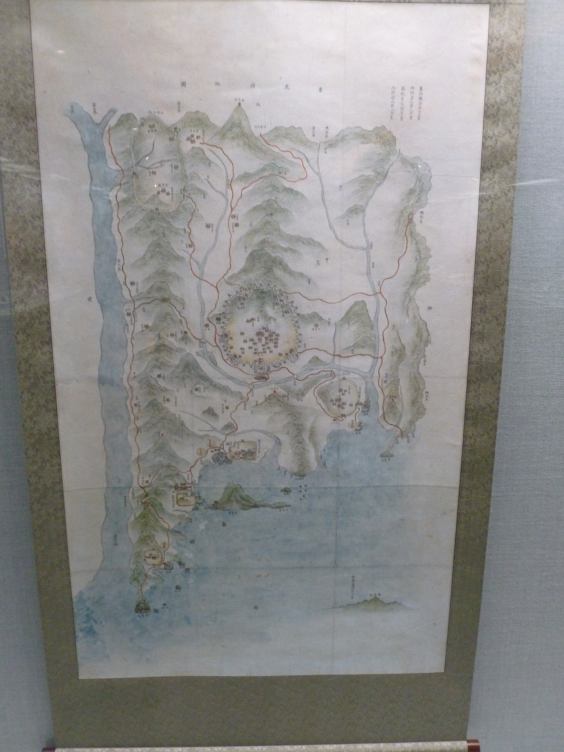 An old regional map photographed inside Busan Museum